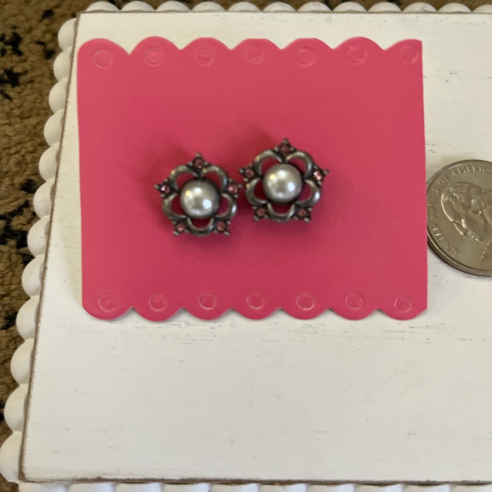 Vintage pewter earrings with pearl center and pink stones.
